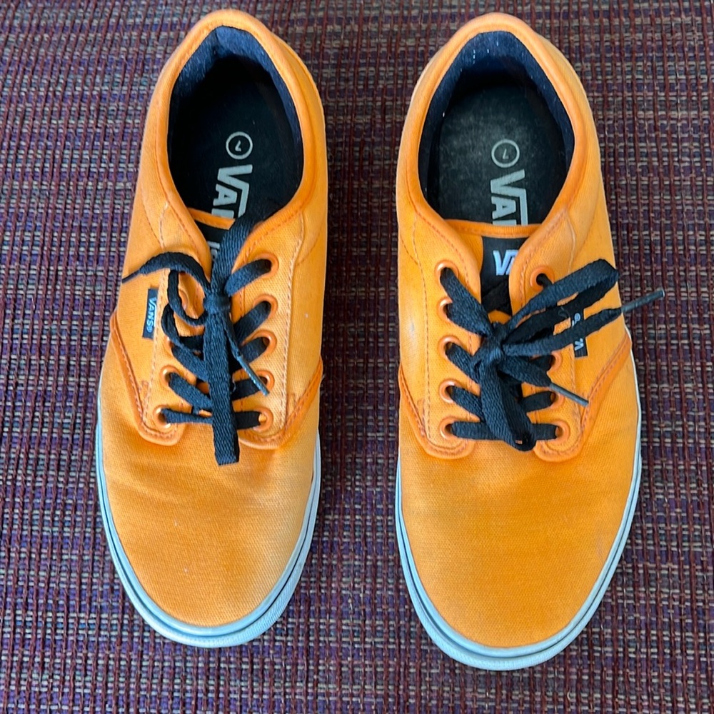 Orange vans, size 7, with black strings!  Perfect with jeans, shorts, dresses!